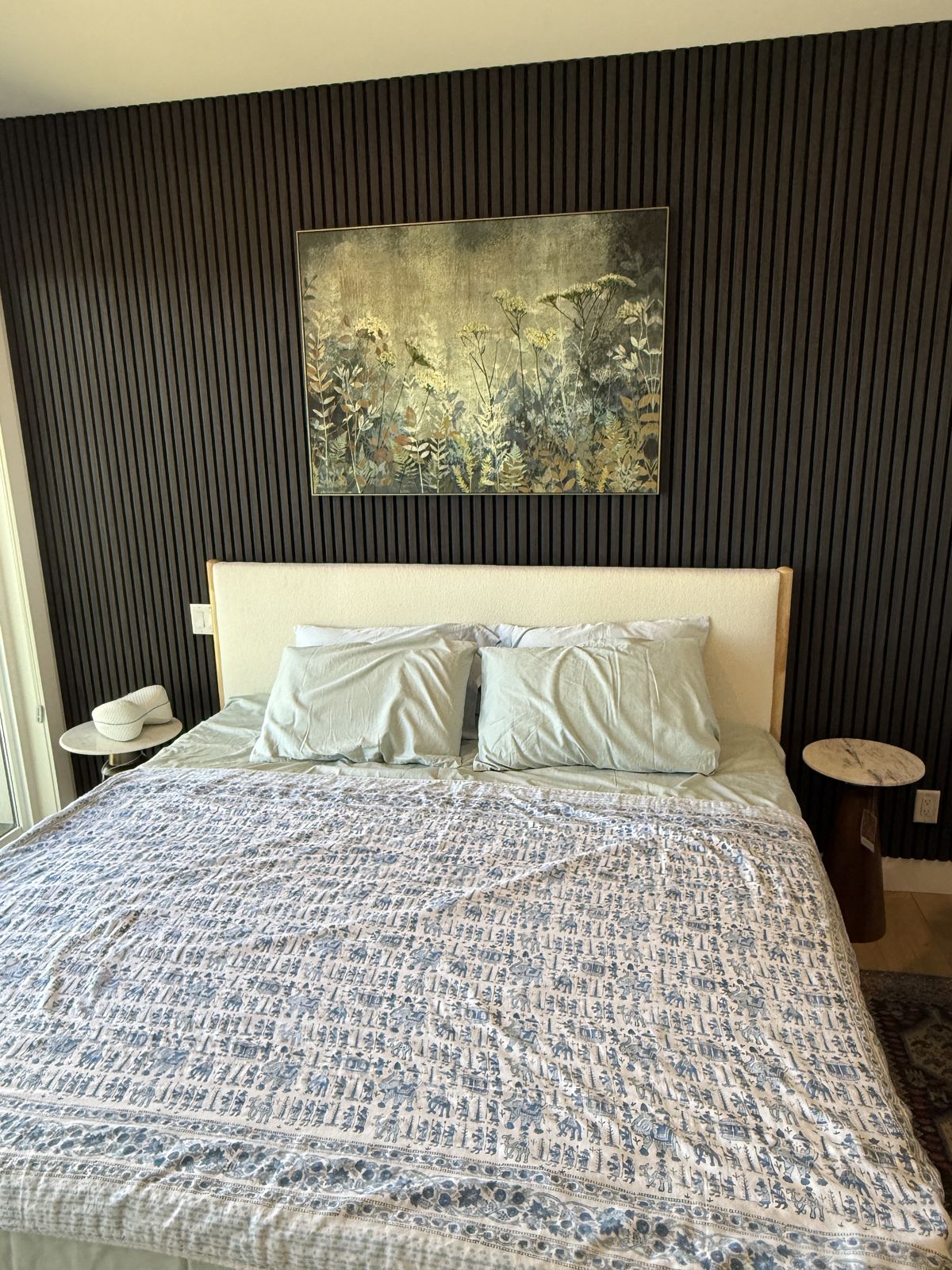 Walnut slat feature wall in a primary bedroom