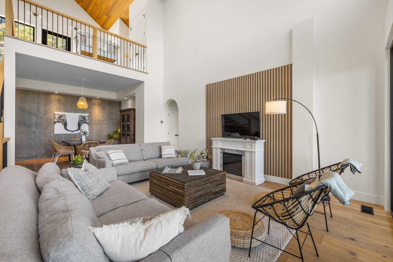 Oak slat feature wall with fireplace in a lakeview living room